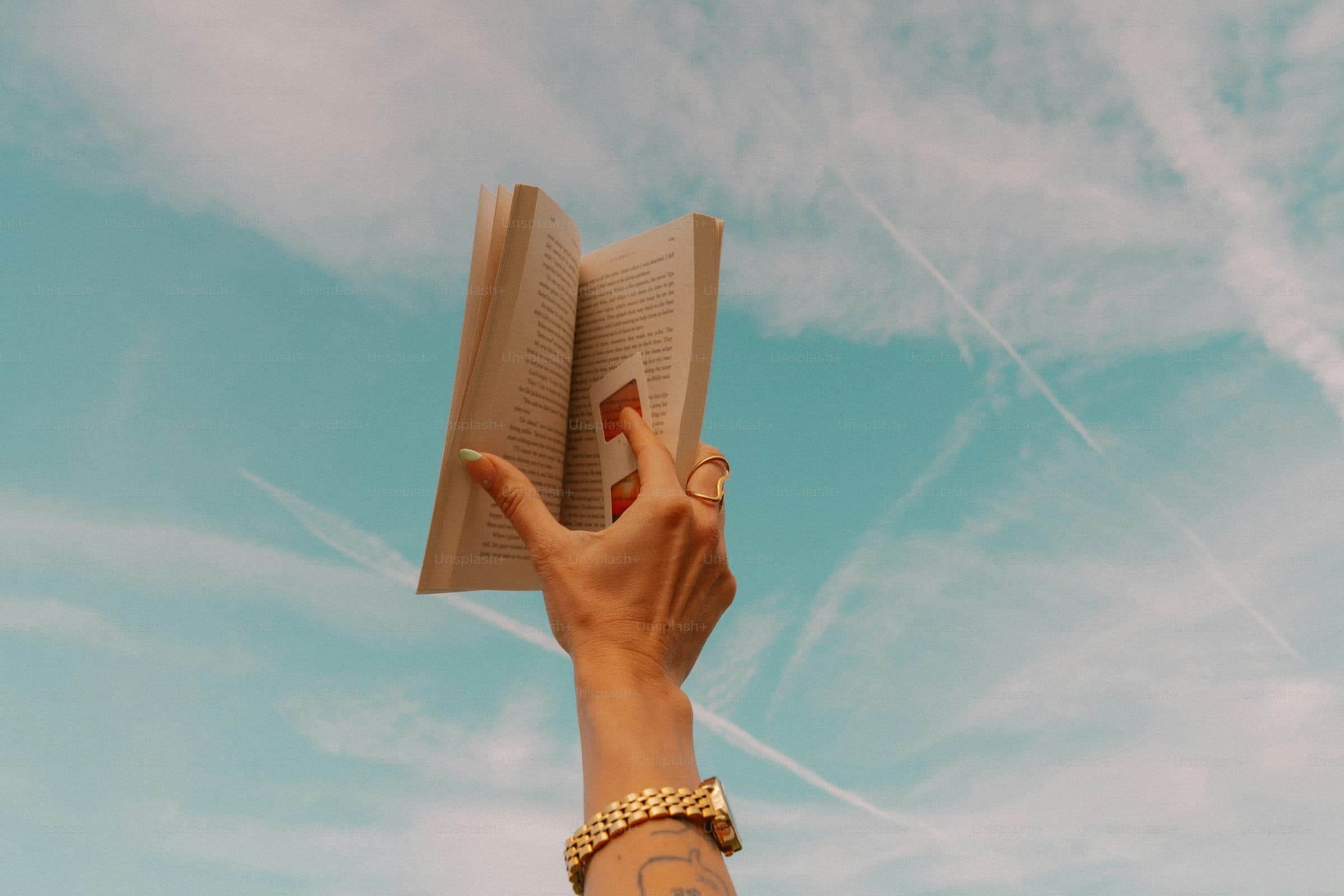 An open book held in two hands